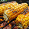 Grilled corn on the cob provides the ultimate smoky summer side dish experience.